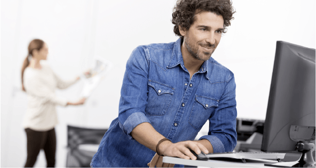 man-in-blueshirt-using-computer0 man-in-blueshirt-using-computer0
